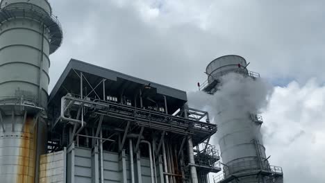 orbit shot of industrial building factory, pollution by smoke emission, sylhet, bangladesh