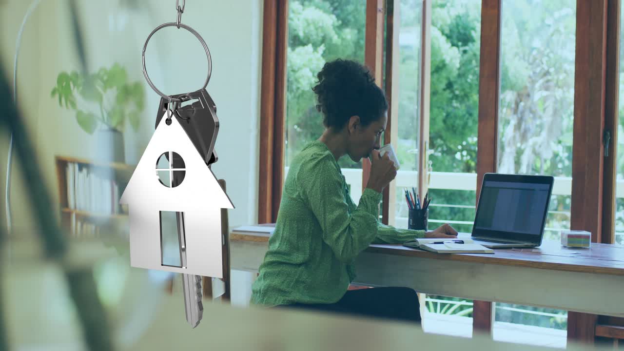 Light shifting, woman typing and checking papers while house keychain rotating, showing real estate