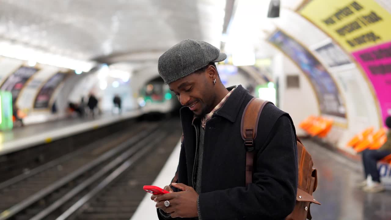 Man using mobile phone at subway station