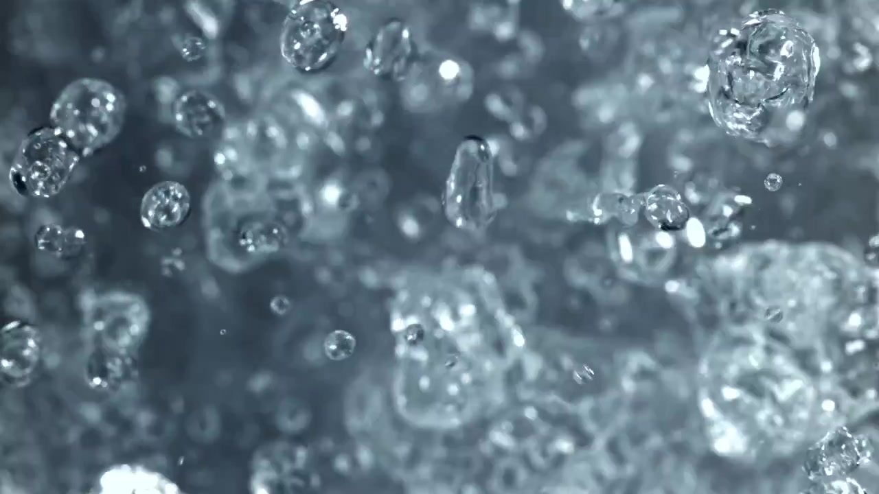 Macro al rallentatore di goccioline d'acqua limpida e bolle