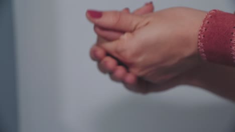 woman washing hands with hydroalcoholic gel 03