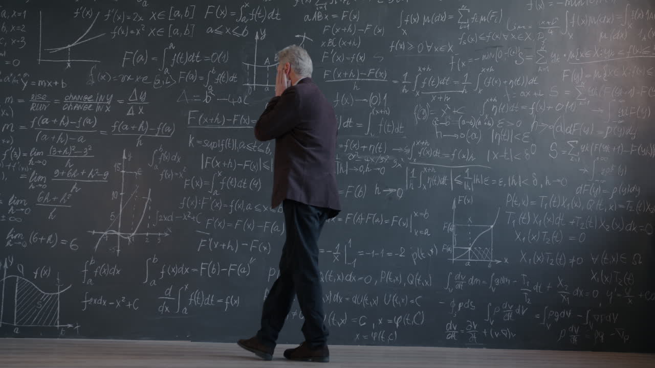 Senior Professor Teaching Math in Classroom