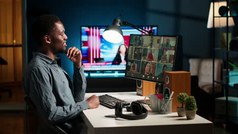 black guy meeting with group of individuals on web video conference
