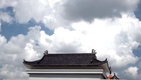 cloud loop above chinese temple roof, time lapse.