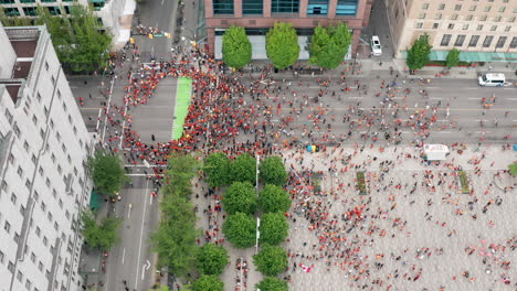 Indigenous-Protesters-in-Downtown-Vancouver-Gather-to-Cancel-Canada-Day,-Drone-Shot-Moving-Forward-in-the-City-Centre