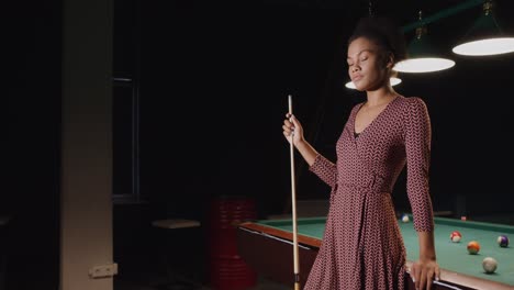 woman playing pool