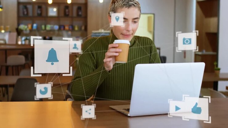 Web of connections icons against woman using laptop