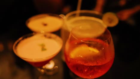 colorful cocktails on a dimly lit table