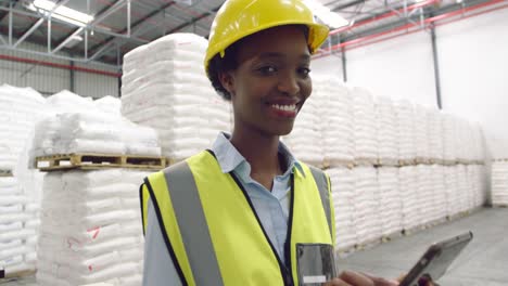 Portrait-of-young-female-manager-in-a-warehouse