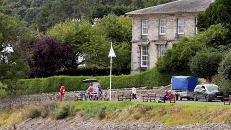 people interacting near a historic building