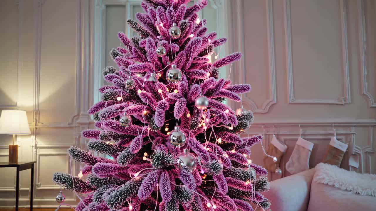 Festive Christmas Tree with Silver Ornaments and Pink Branches