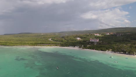 aerial view of a beach in falmouth, jamaica, showcasing turquoise waters, white sand, and lush coastal scenery.