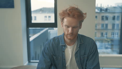 Young-Red-Haired-Man-Working-From-Home-Typing-With-Laptop