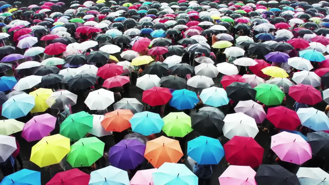 Crowd with Colorful Umbrellas in the Rain