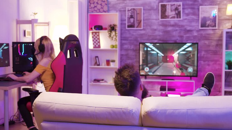 Team di gaming che gioca ai videogiochi in una stanza