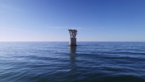 unusual tower in the middle of the mediterranean sea