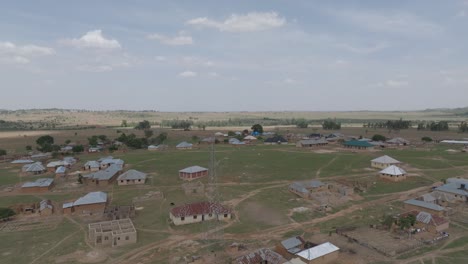 forward rising aerial shot of african countryside on sunny and cloudy day