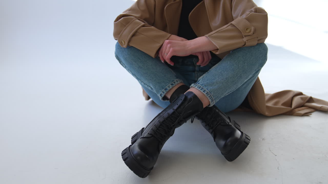Woman Sitting in Fashionable Outfit