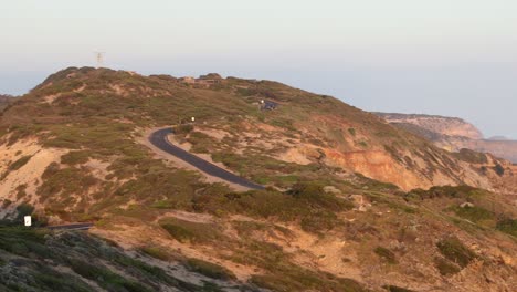 winding road along cliffs by the ocean