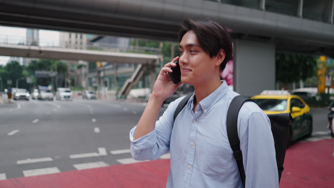 Young Man on the Street Talking on the Phone