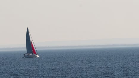 sailboat gliding across calm ocean waters