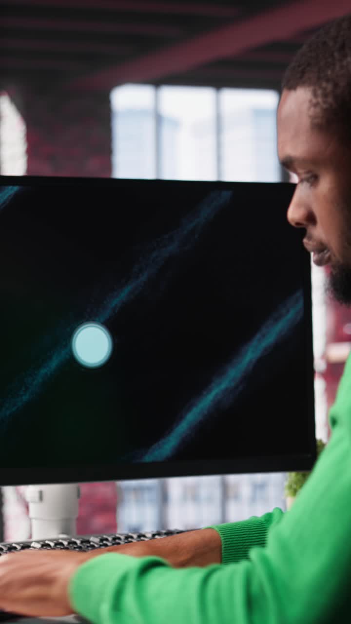 Vertical Video Black freelancer at home watching business conference on PC monitor