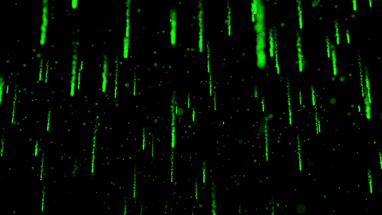 Abstract green particles rain down like digital matrix code or meteor shower on black background. Technology or sci-fi concept, seamless loop, vfx, motion graphic