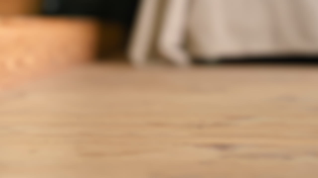 Little girl playing with a wooden snail rolling toy on the floor. Ecological and sustainability concept