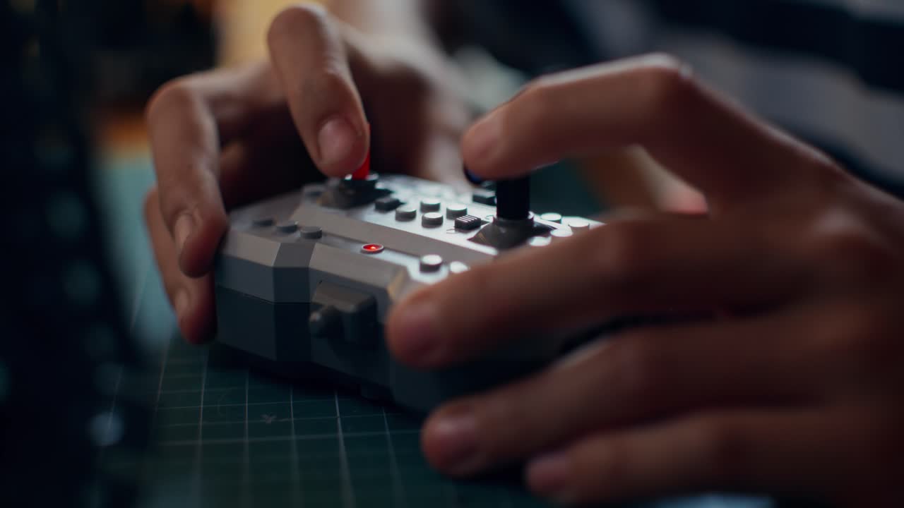 Child playing with a Lego-style remote control