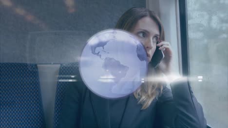 Animation-of-grey-globe-over-businesswoman-on-train-talking-on-smartphone