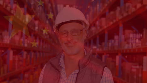 animation of flag of china over senior caucasian worker smiling in warehouse