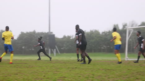 playing soccer on field, team running and preparing for match on foggy day