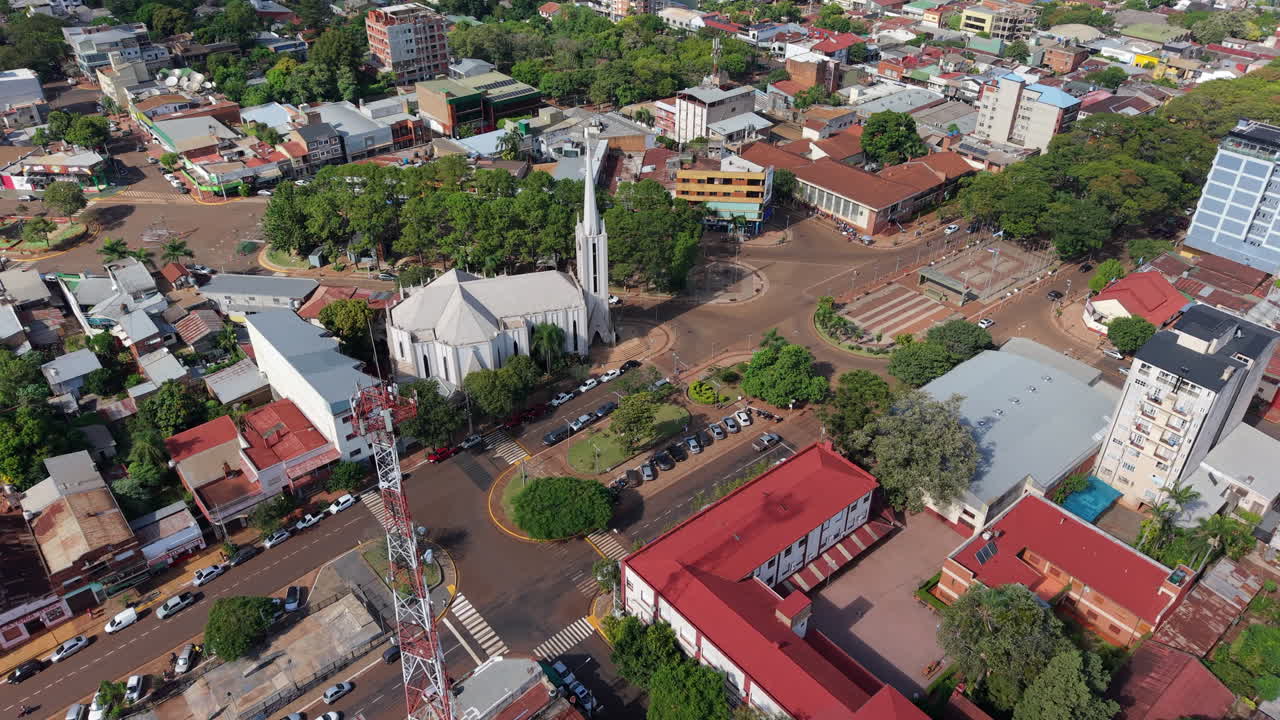 Sideways aerial movement around the Catedral San Antonio and a mix of residential and commercial areas, Oberá, Misiones, Argetina.