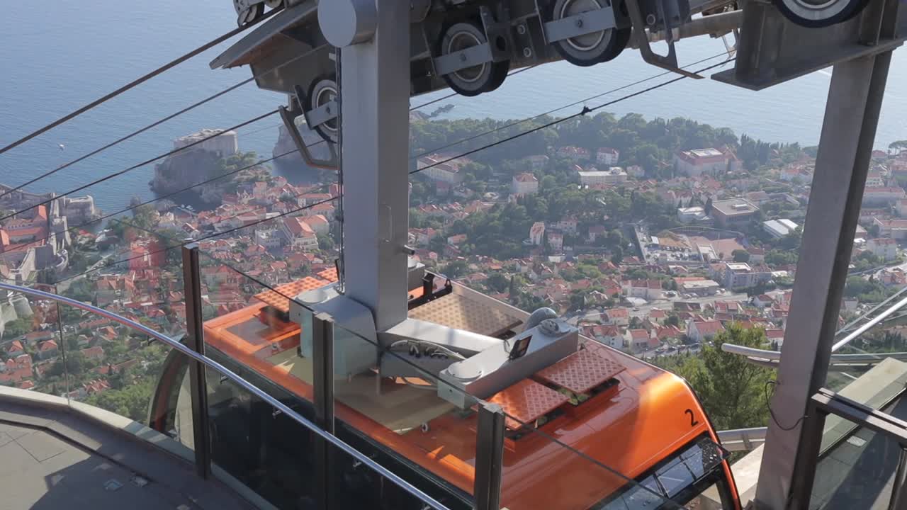 Holiday fun people travelling in dubrovnik in a cable car