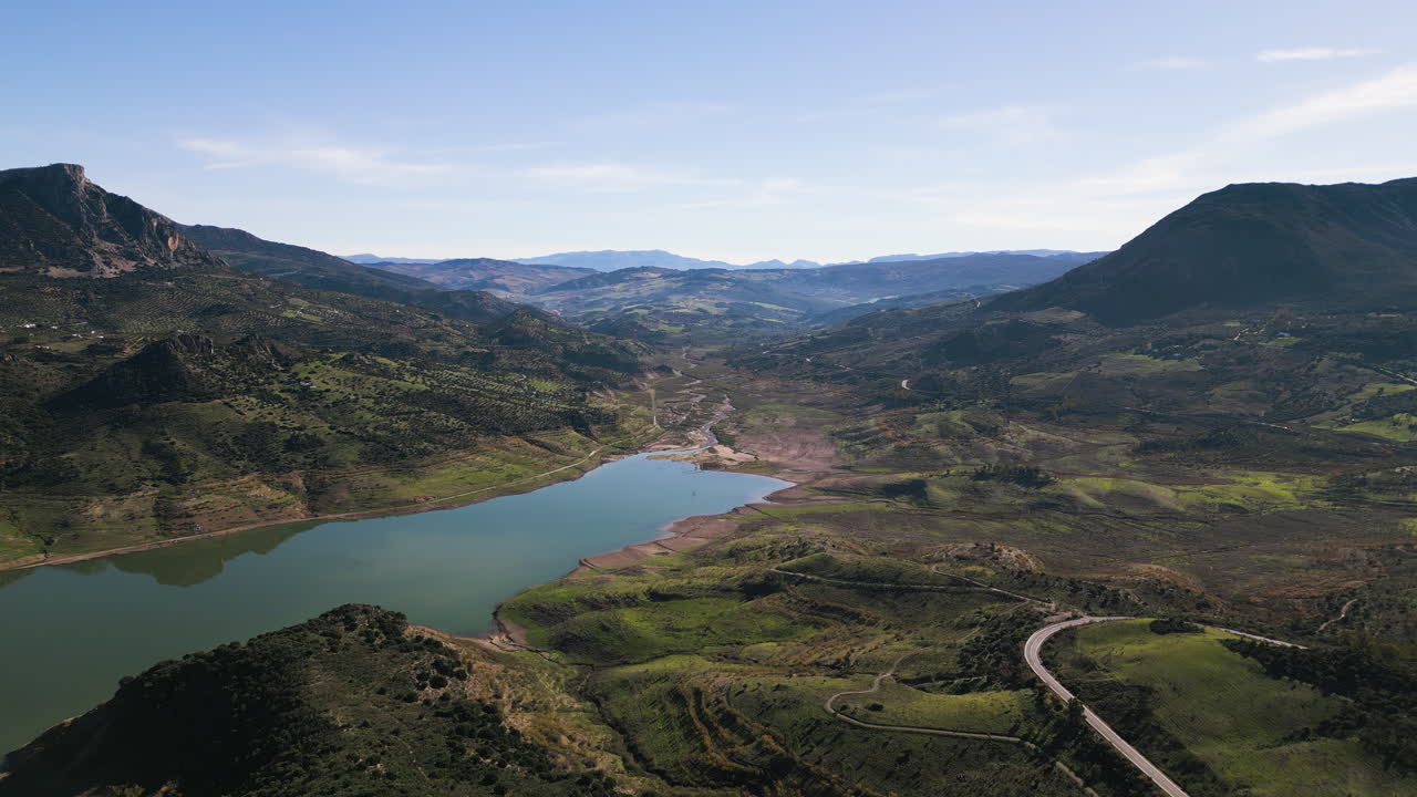 Aerial drone pushes in on the Zahara-El Gastor Reservoir, Andalusia, Spain.