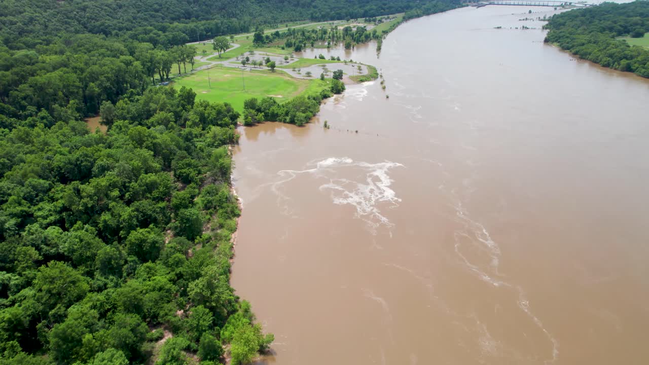 Aerial footage of Murray Park in Little Rock, Arkansas. Camera is flying approximately west over the Arkansas river