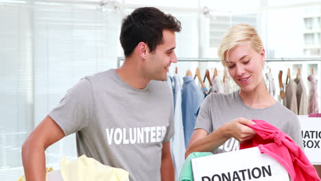 volunteers friends holding donation boxes