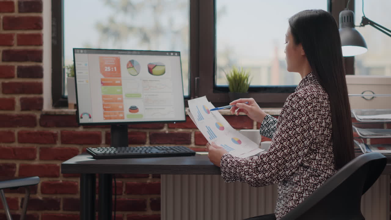 Business woman working on financial paperwork with files