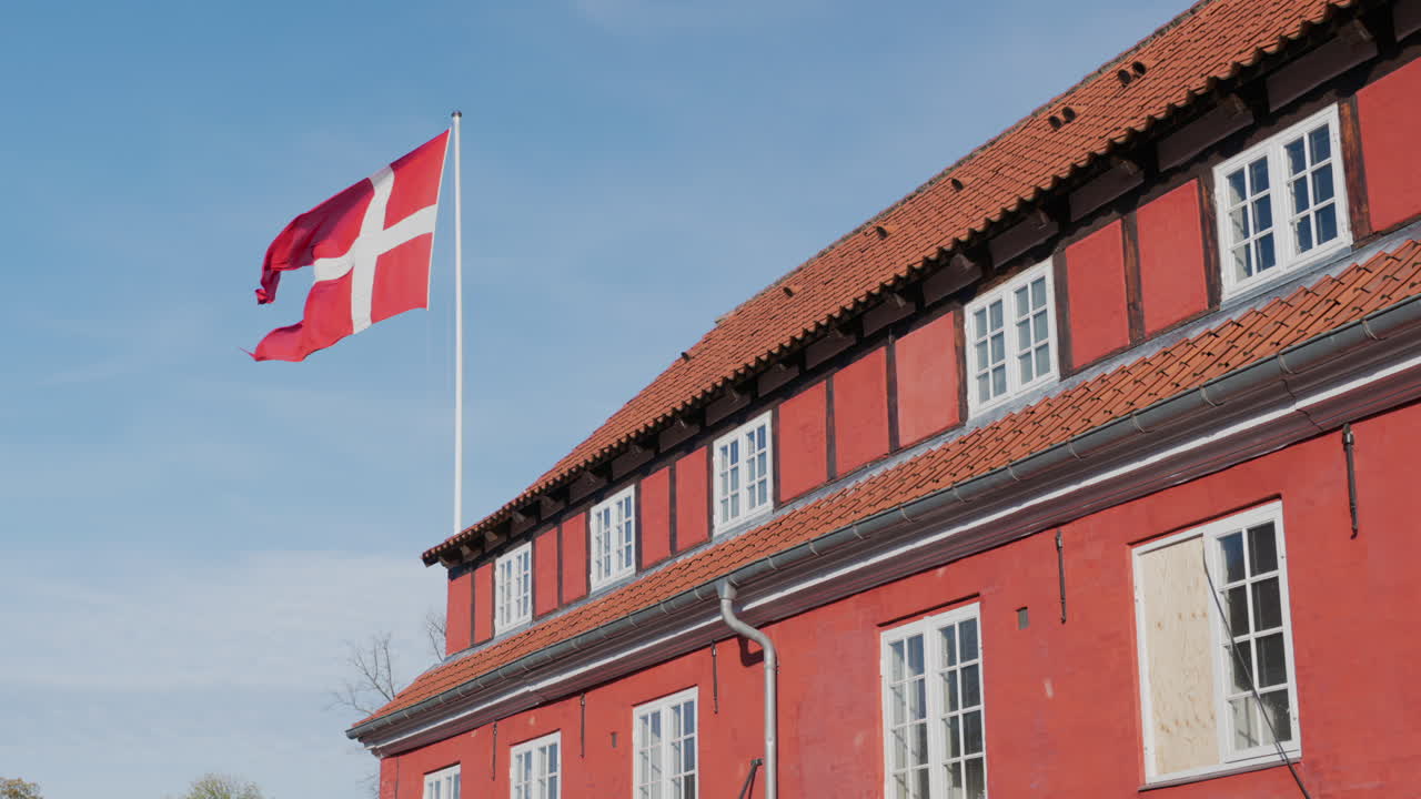 Danish flag waving over the Kastellet Citadel in the city centre of Copenhagen, Denmark