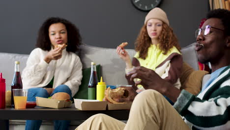 three friends eating at home