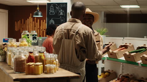 small business owner receiving new produce stock from contractor