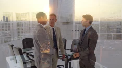 Animation-of-businessman-handshake-over-cityscape