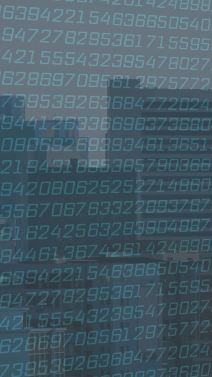 Binary numbers animating over cityscape with tall buildings