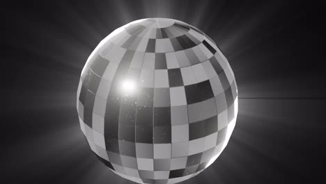 animation of monochrome rotating mirrorball and lights on black background