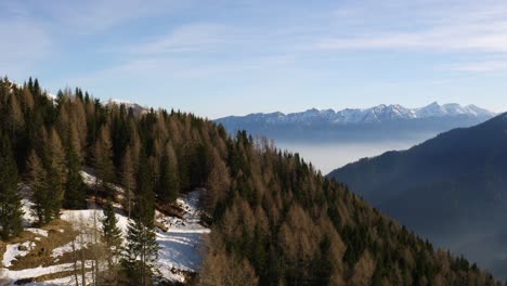 Aerial-panoramic-view-of-Italian-mountain-range-landscape-and-valley-shrouded-in-fog