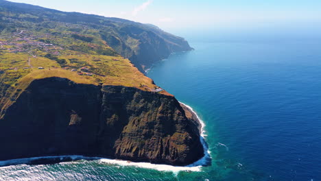 mountainous shore of the madeira islands, portugal on sunny day. aerial scenery of the waterscape of the atlantic ocean.