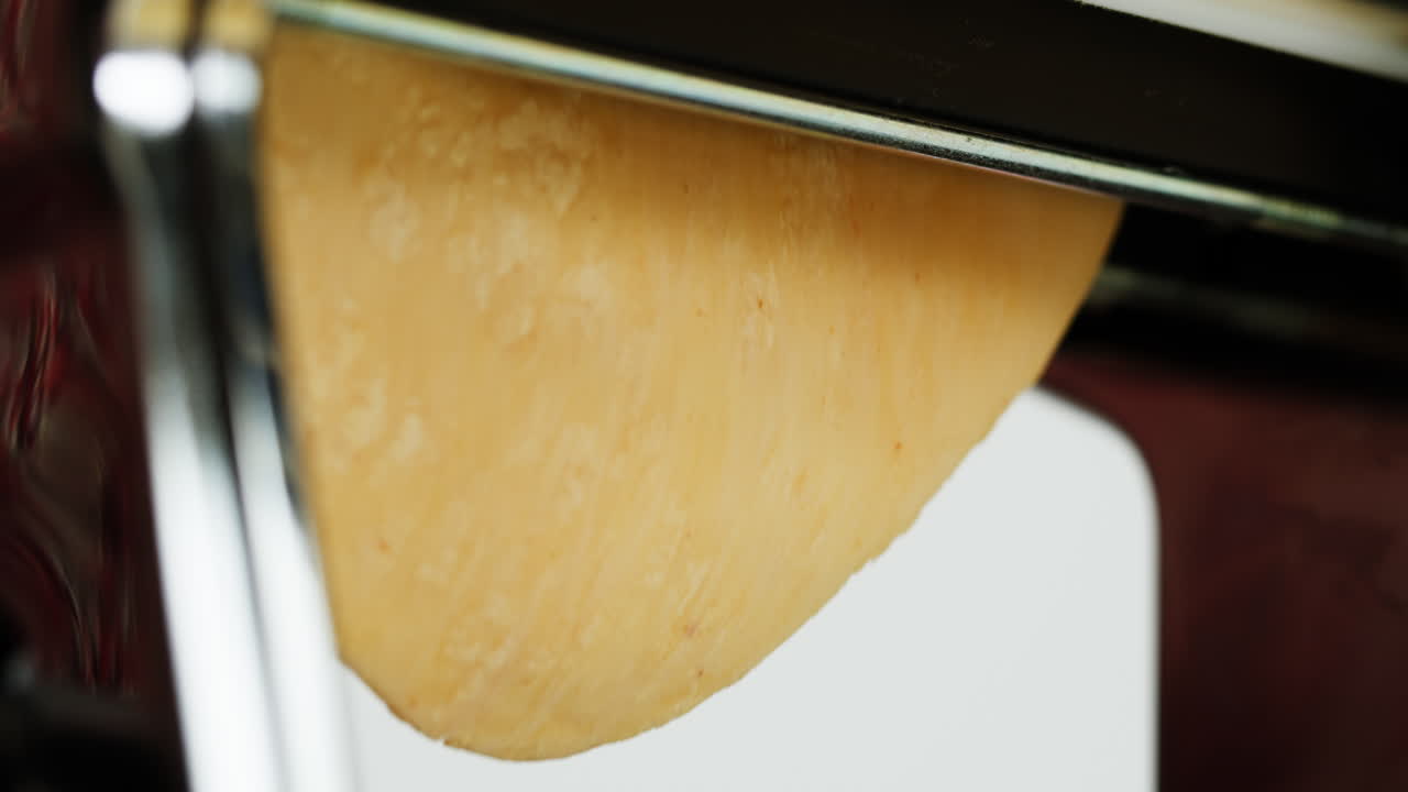 Rolling Fresh Pasta Dough Through a Pasta Maker