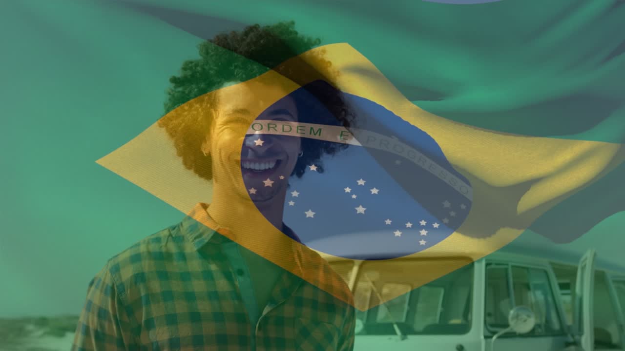 ブラジル国旗が、ビーチで楽しんでいるアフリカ系アメリカ人の若者のポートレートの上で波打つアニメーション