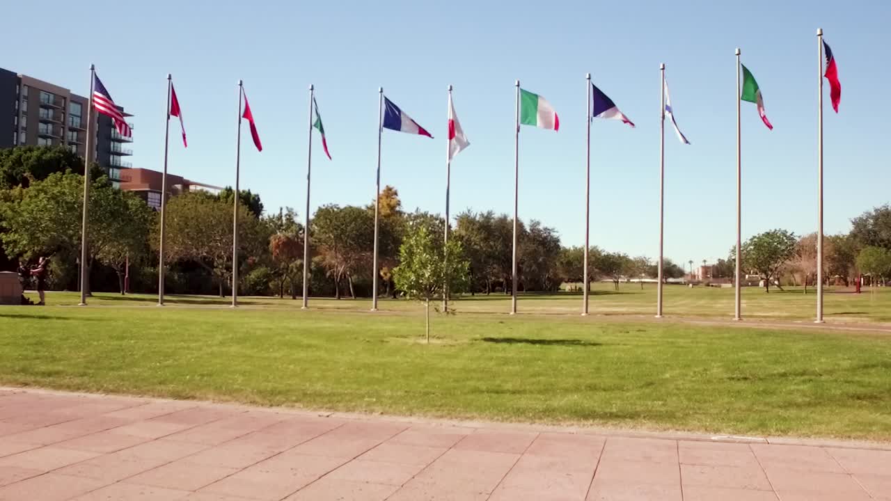 Push in on multinational flags decorating the Margret Hanse deck park, Phoenix Arizona
