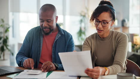 couple reviewing financial documents